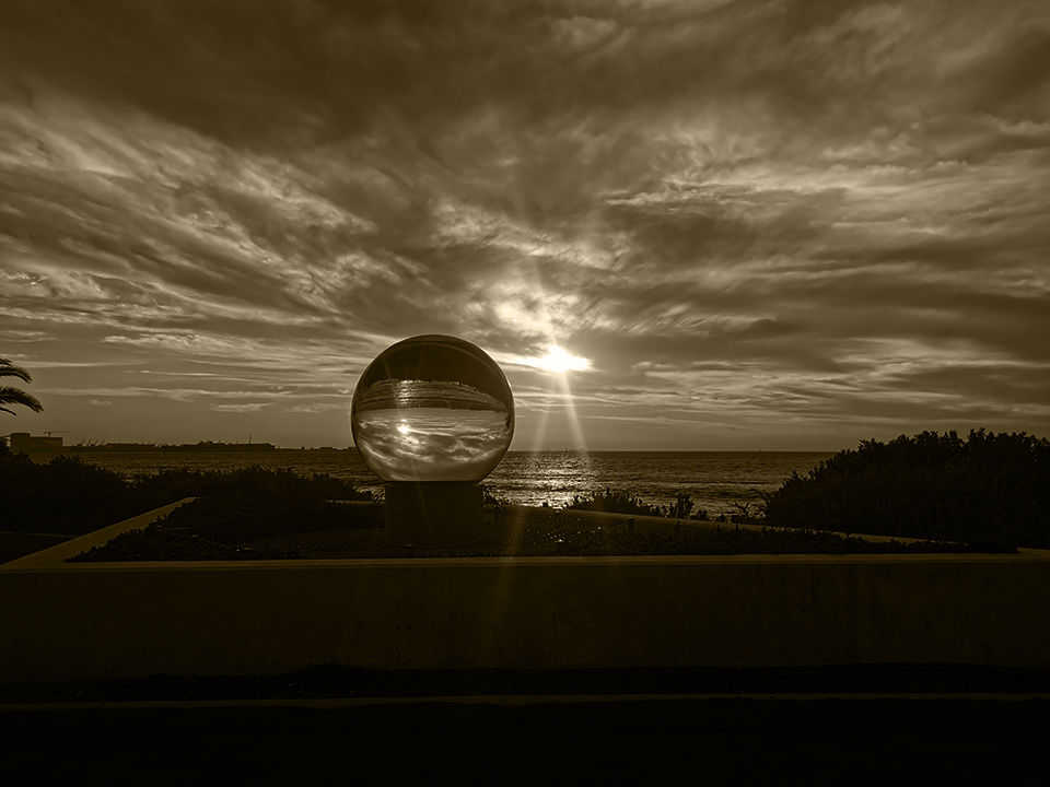 The big Marble at Sunset reflecting colors of nature - cloud, sea, greens