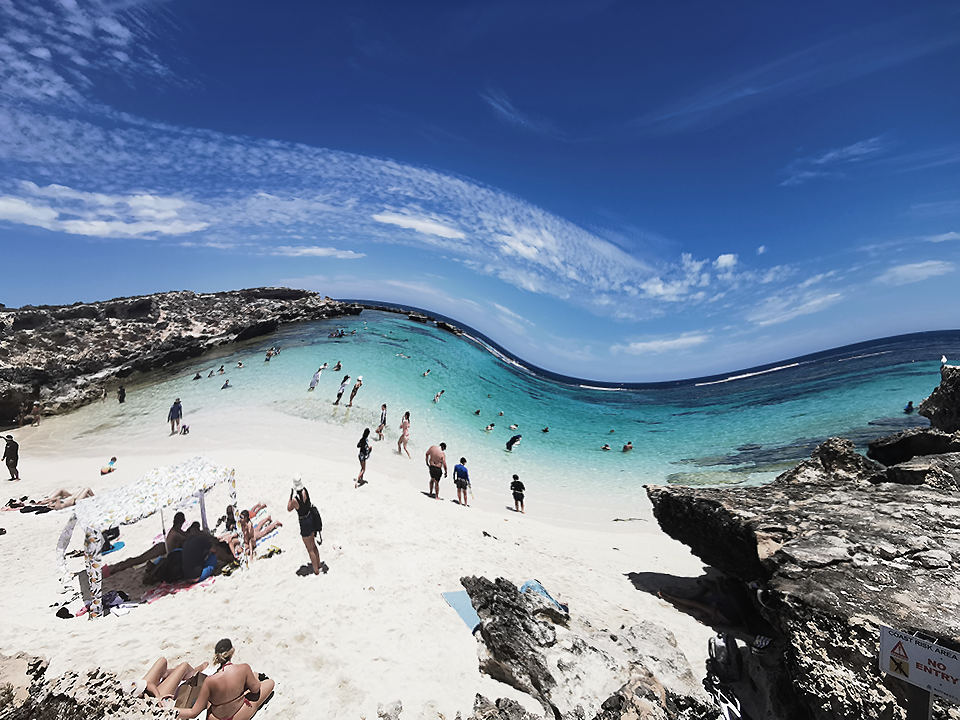 Lots of people in Rottnest island enjoy sunshine and colorful sea or stand on the sandy beaches