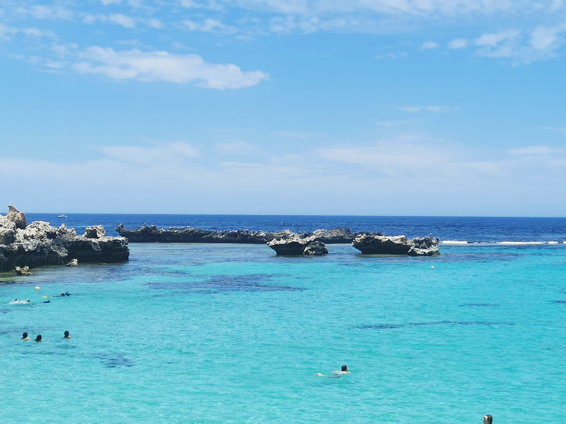 Western Australia Rottnest Island blue and green sea water with purely blue sky set with rocks